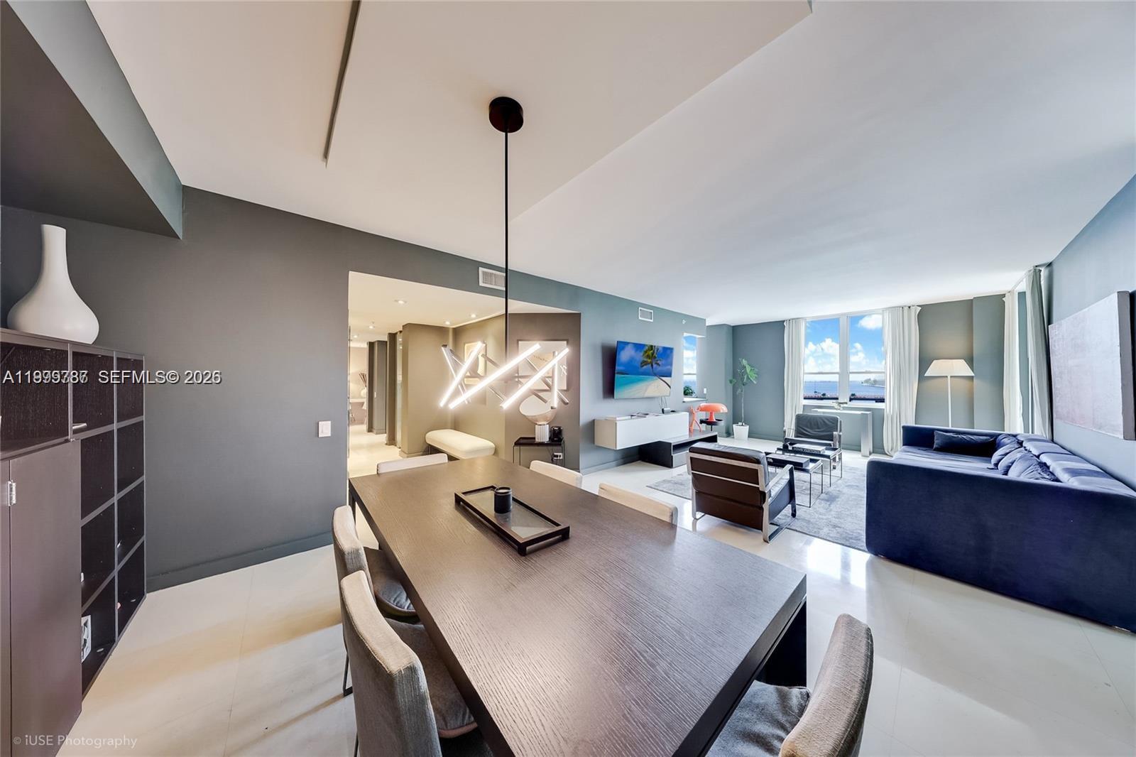 701 Brickell Key Boulevard, Unit 503 Miami, FL 33131 - Photo 3 of 25 a view of a dining room with furniture window and wooden floor