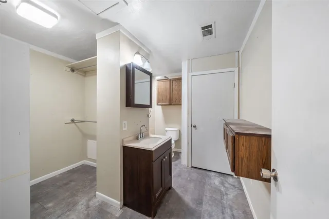 a view of bathroom with two sink and a mirror