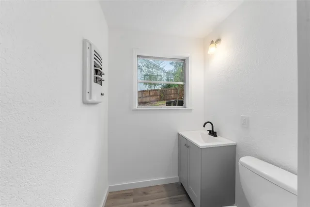 a bathroom with a toilet and a sink