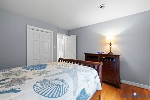 a bed room with a bed and a lamp