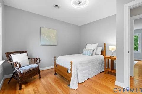 a bedroom with a bed and a couch