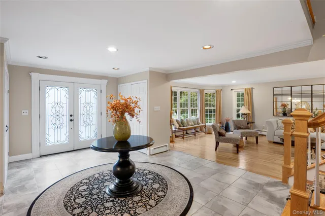 a kitchen with stainless steel appliances granite countertop a sink stove refrigerator and cabinets