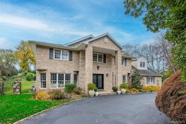 a view of street with houses and trees in the background