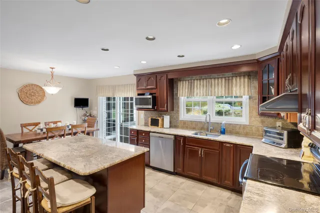 a bedroom with a bed and flat screen tv