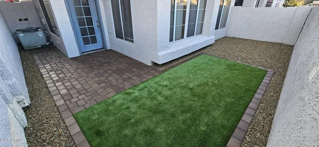 a view of a back yard of a house