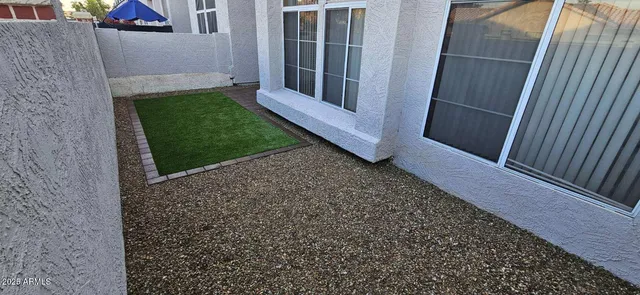 a view of backyard with small cabin