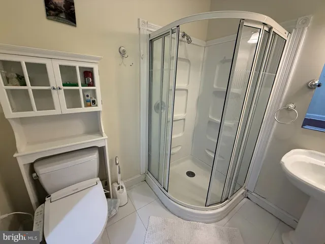 a bathroom with a shower and toilet