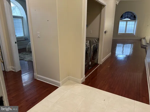 a view of a hallway view with wooden floor and staircase