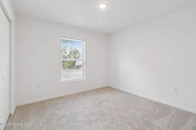 a bathroom with a sink toilet vanity and shower