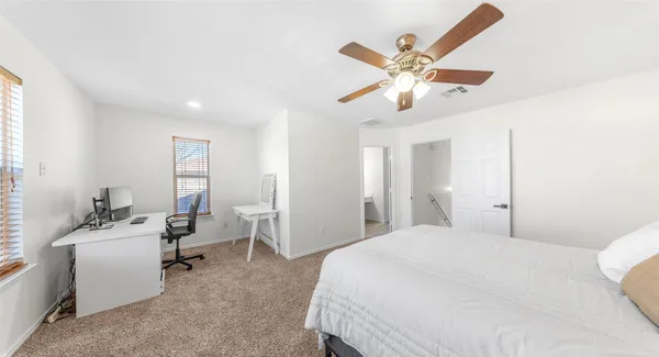 a bedroom with a bed and furniture