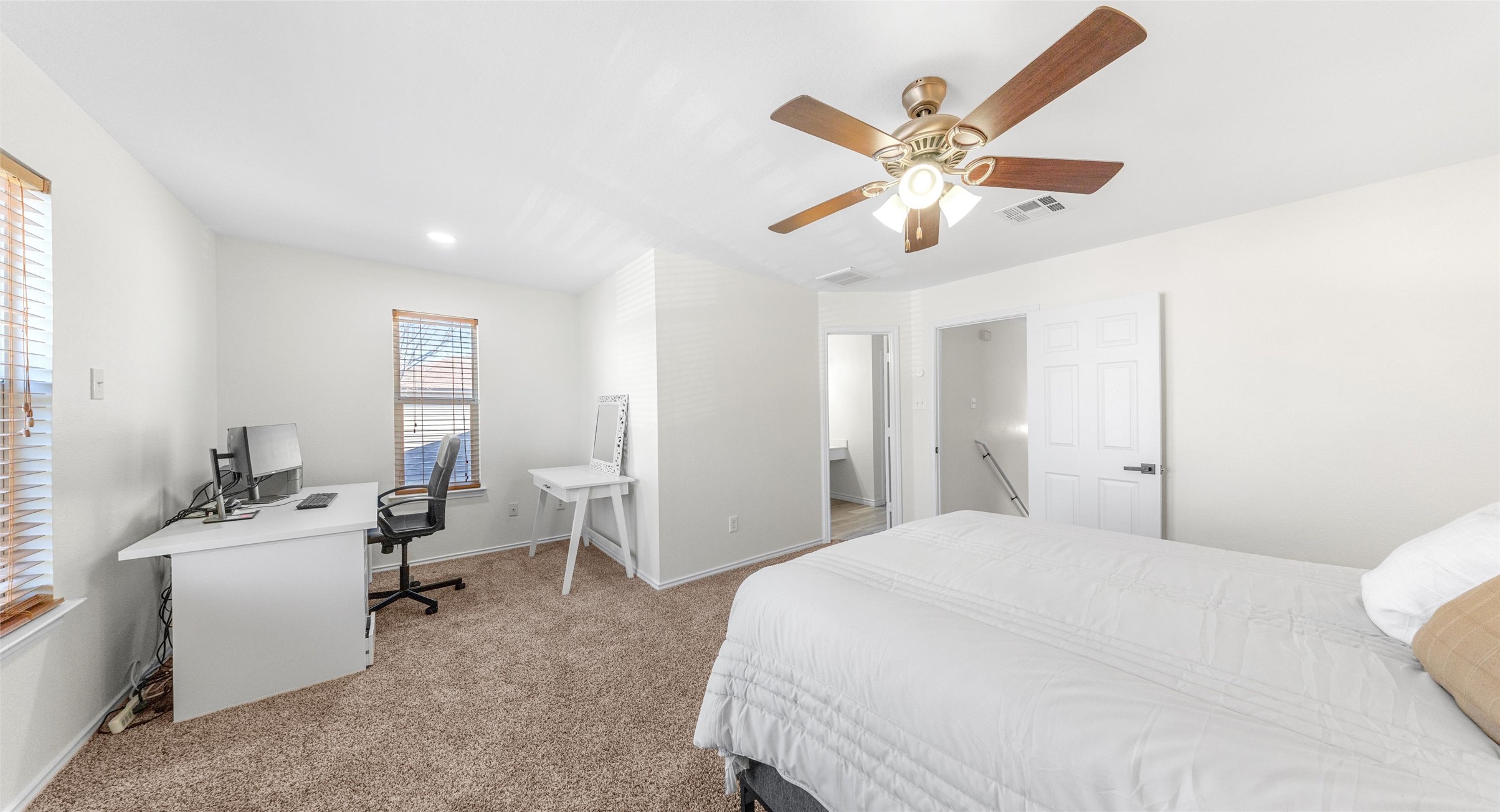 8613 Wiley Way Austin, TX 78747 - Photo 19 of 33 Bedroom with a desk, light colored carpet, and ceiling fan