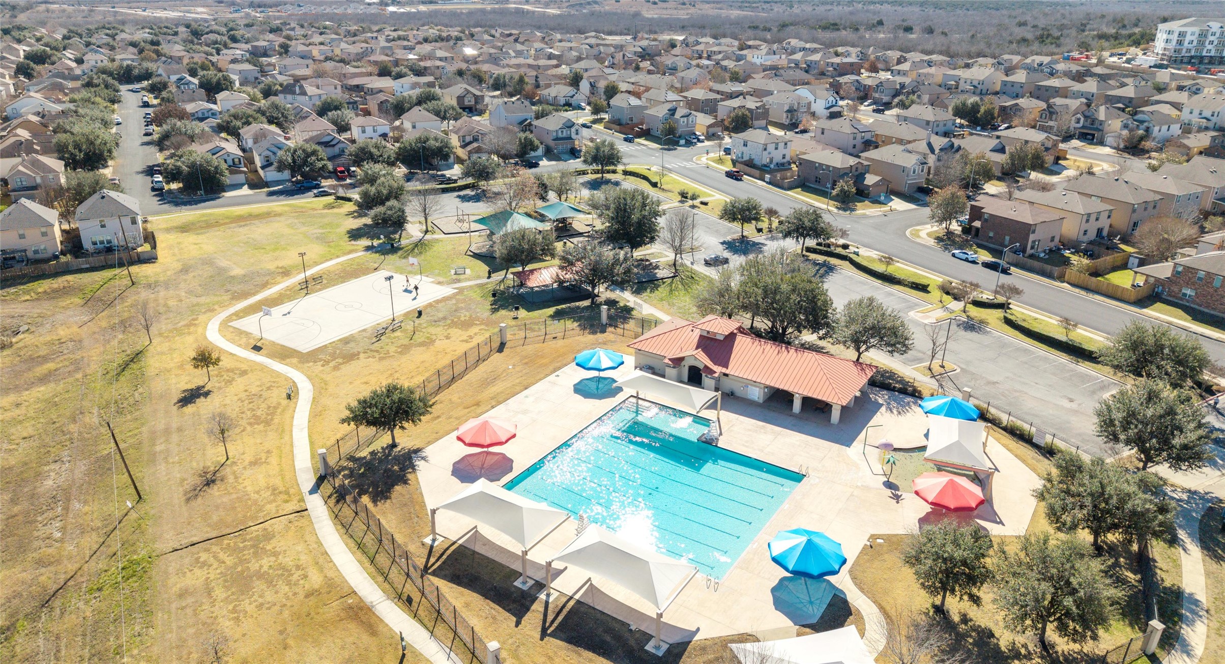 8613 Wiley Way Austin, TX 78747 - Photo 32 of 33 Aerial view of property and surrounding area with a pool area and nearby suburban area