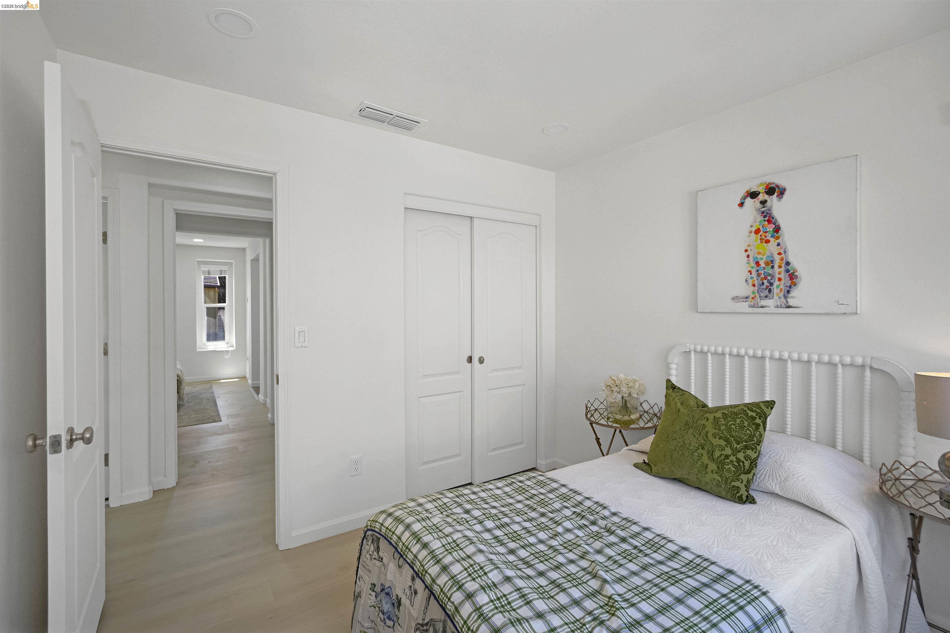 449 Constantine Court San Ramon, CA 94583 - Photo 38 of 63 Light-filled interior featuring white walls, a white paneled door, and wood-finish flooring