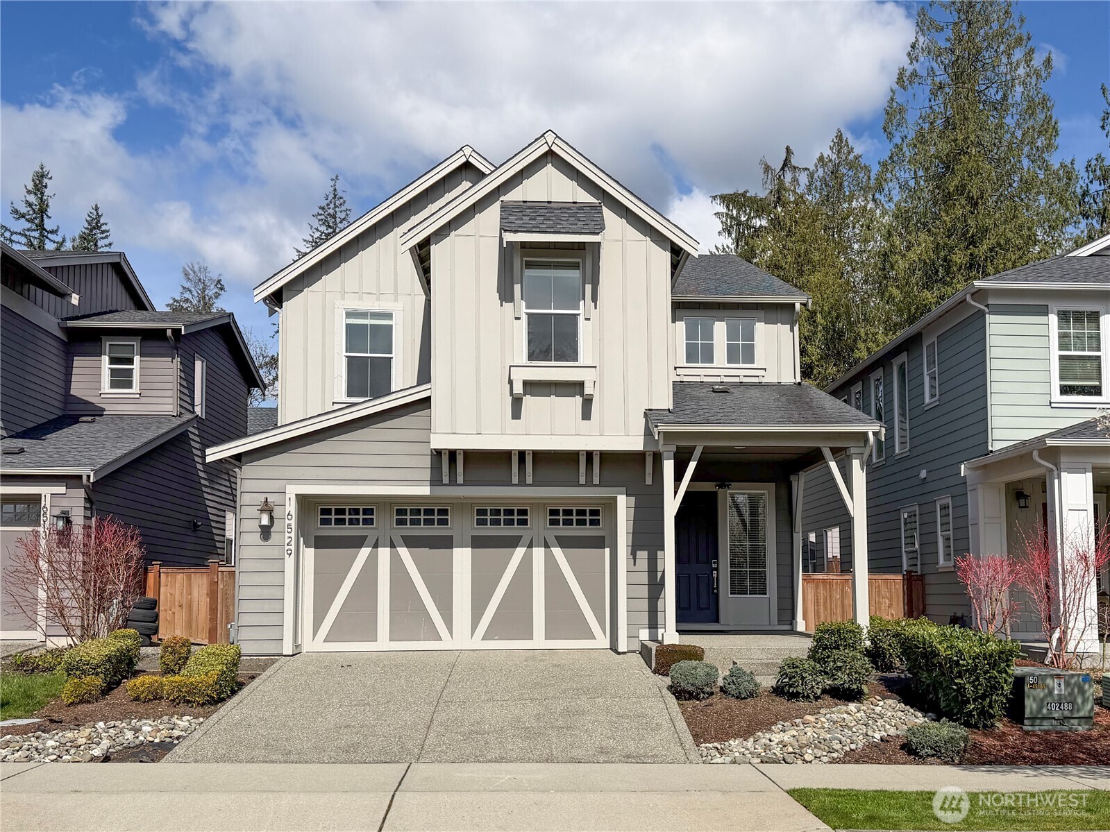 16529 White Mountain Road Southeast Monroe, WA 98272 - Photo 3 of 34 a front view of a house with garden
