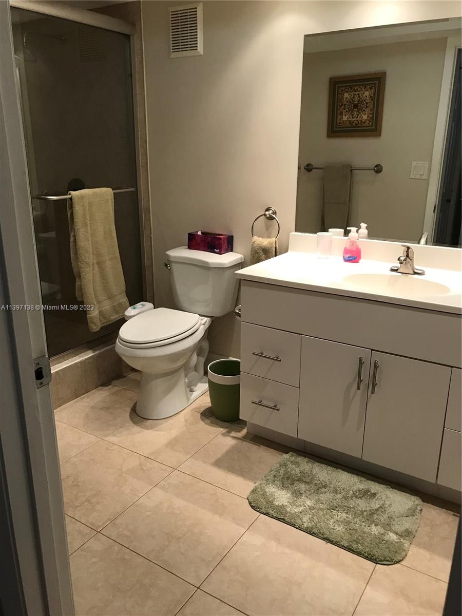 Bonaventure Weston, FL 33326 - Photo 11 of 14 a bathroom with a sink mirror and toilet
