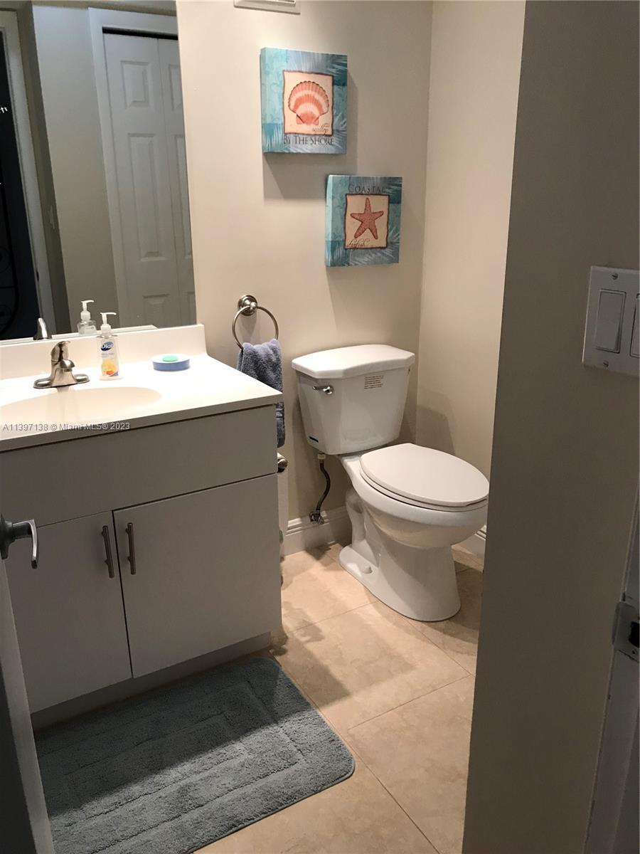 Bonaventure Weston, FL 33326 - Photo 14 of 14 a bathroom with a sink toilet and a mirror