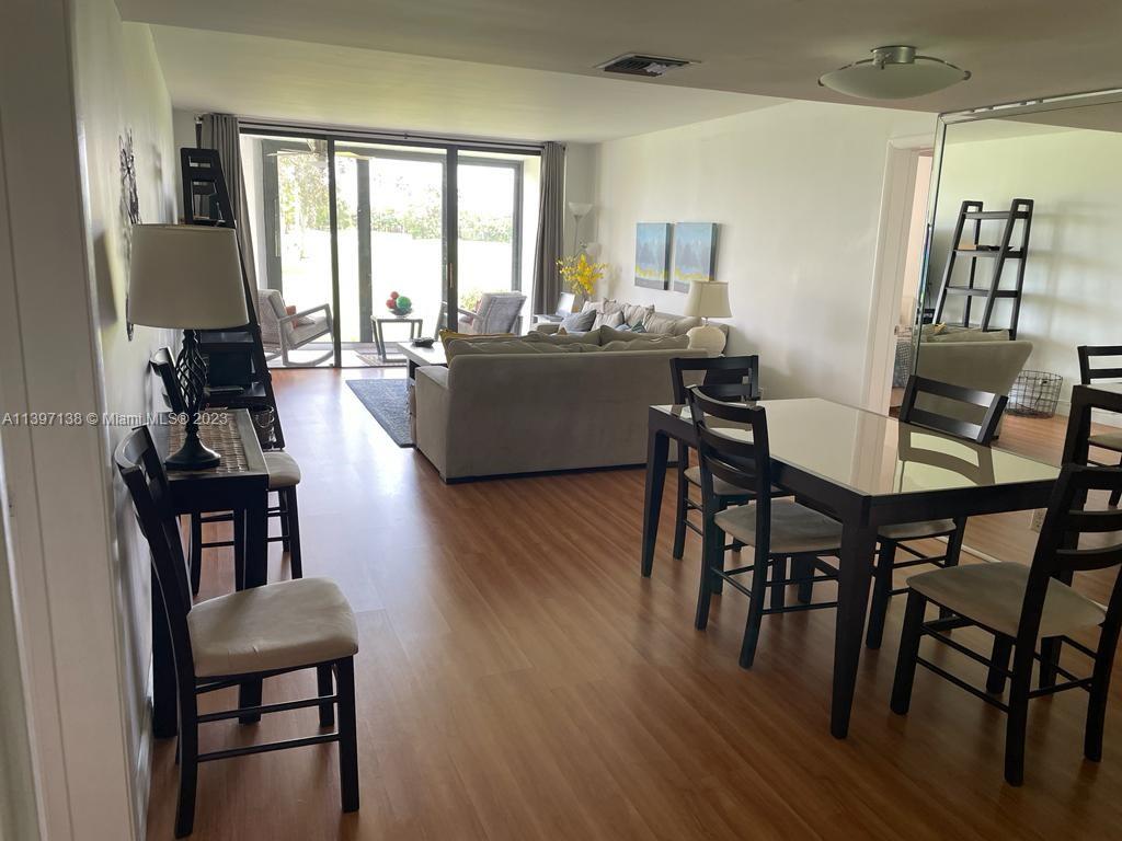 Bonaventure Weston, FL 33326 - Photo 7 of 14 a living room with furniture and a table