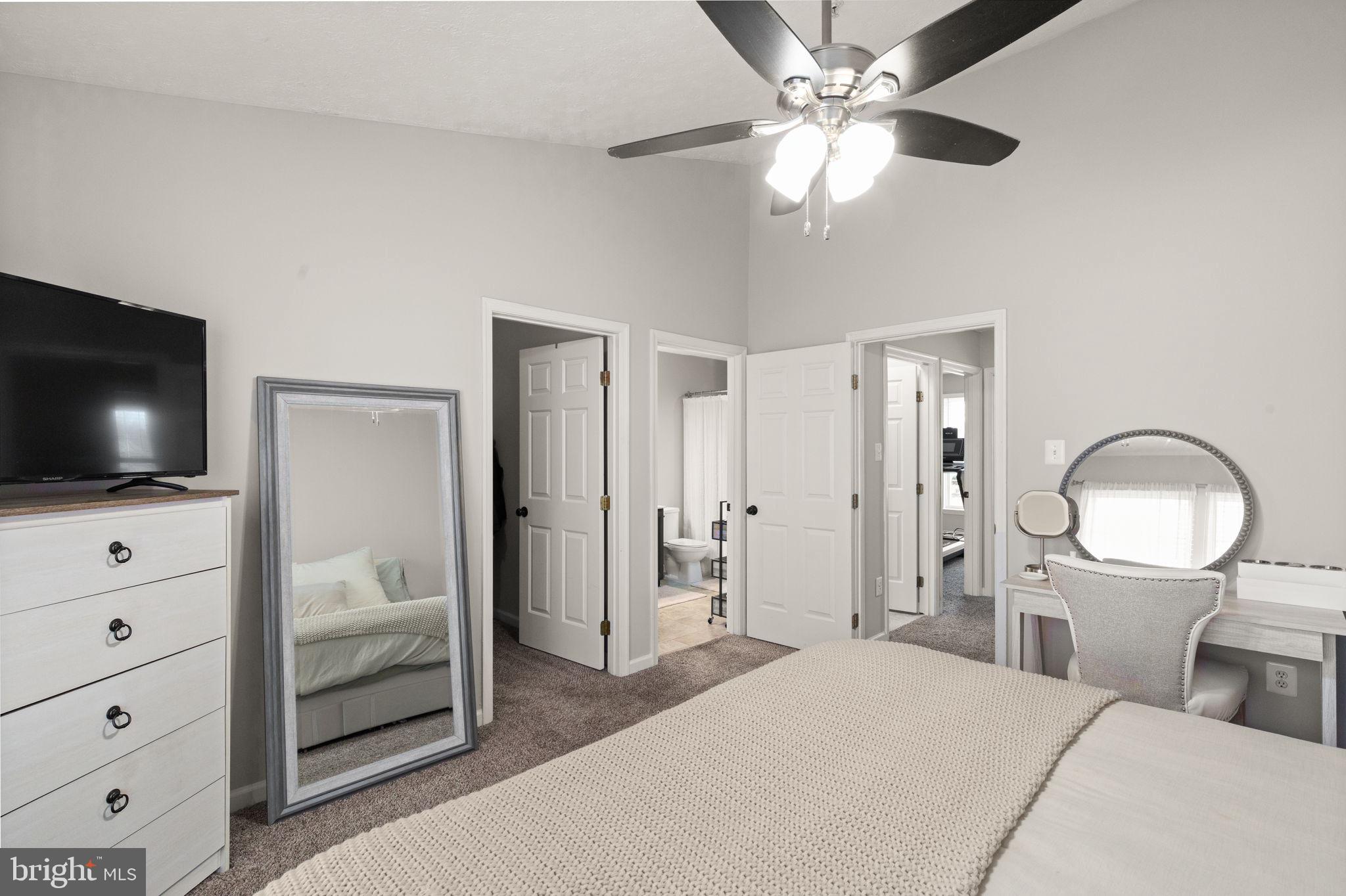 488 Crestridge Way Abingdon, MD 21009 - Photo 13 of 22 a bedroom with a bed and a flat screen tv