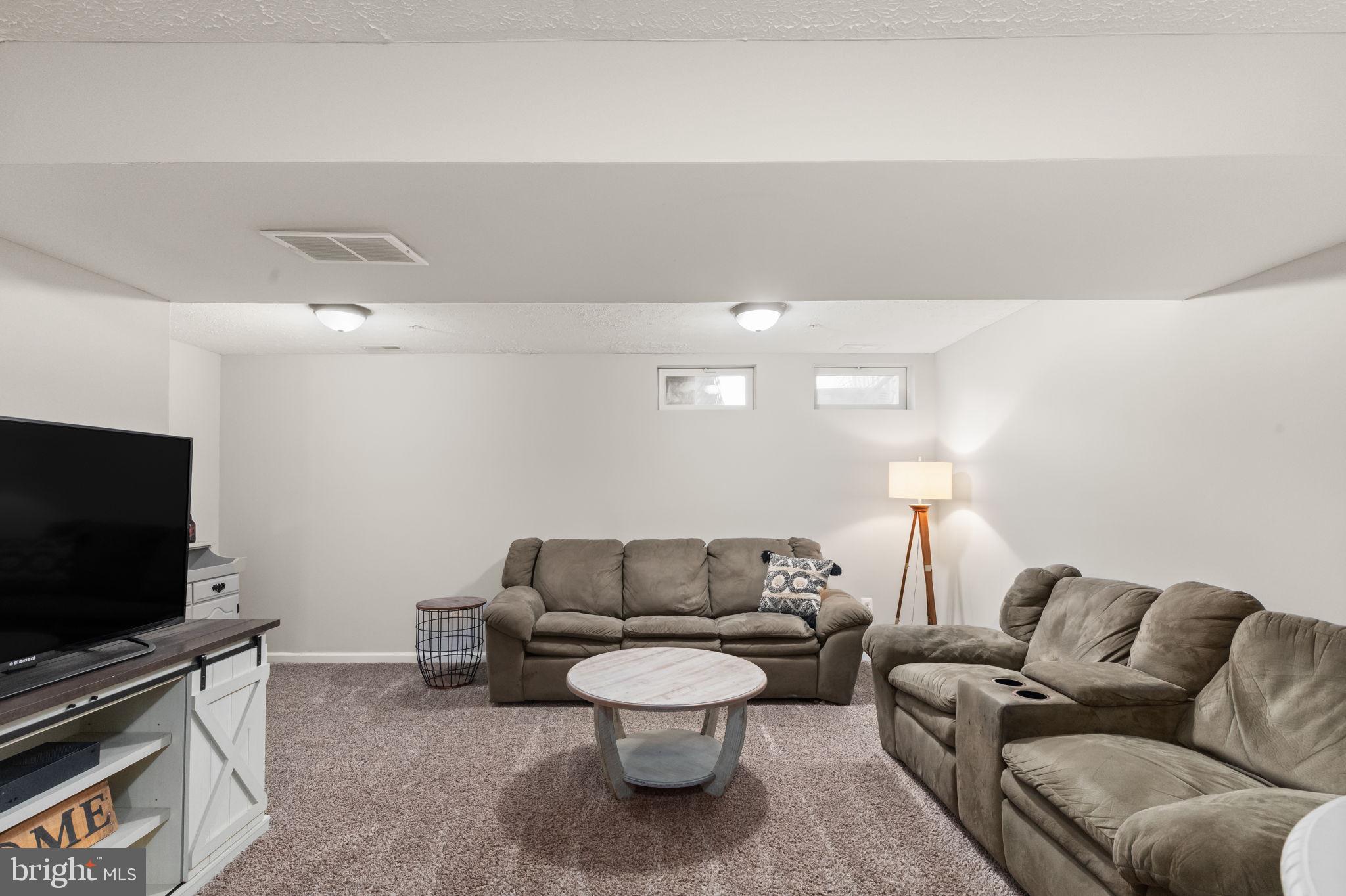 488 Crestridge Way Abingdon, MD 21009 - Photo 17 of 22 a living room with furniture and a flat screen tv