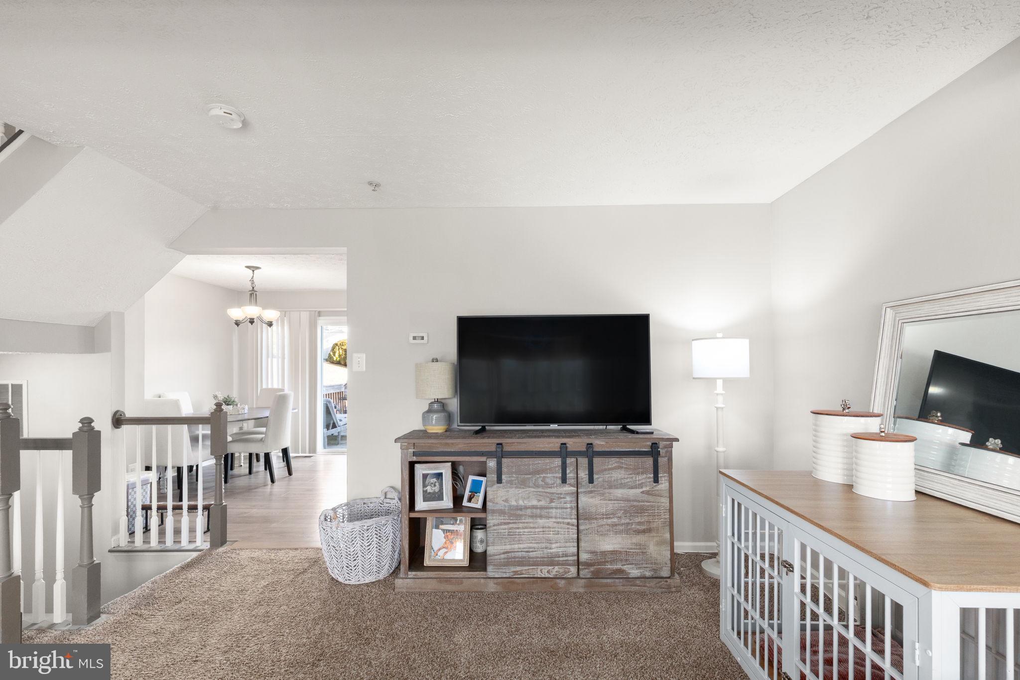 488 Crestridge Way Abingdon, MD 21009 - Photo 9 of 22 a view of a livingroom with furniture and a flat screen tv
