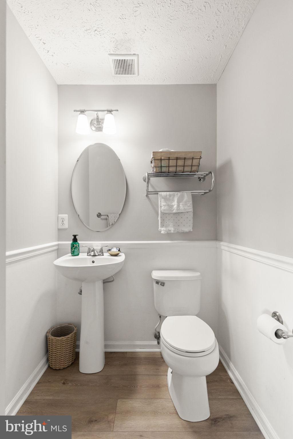 488 Crestridge Way Abingdon, MD 21009 - Photo 10 of 22 a bathroom with a toilet a sink and a mirror