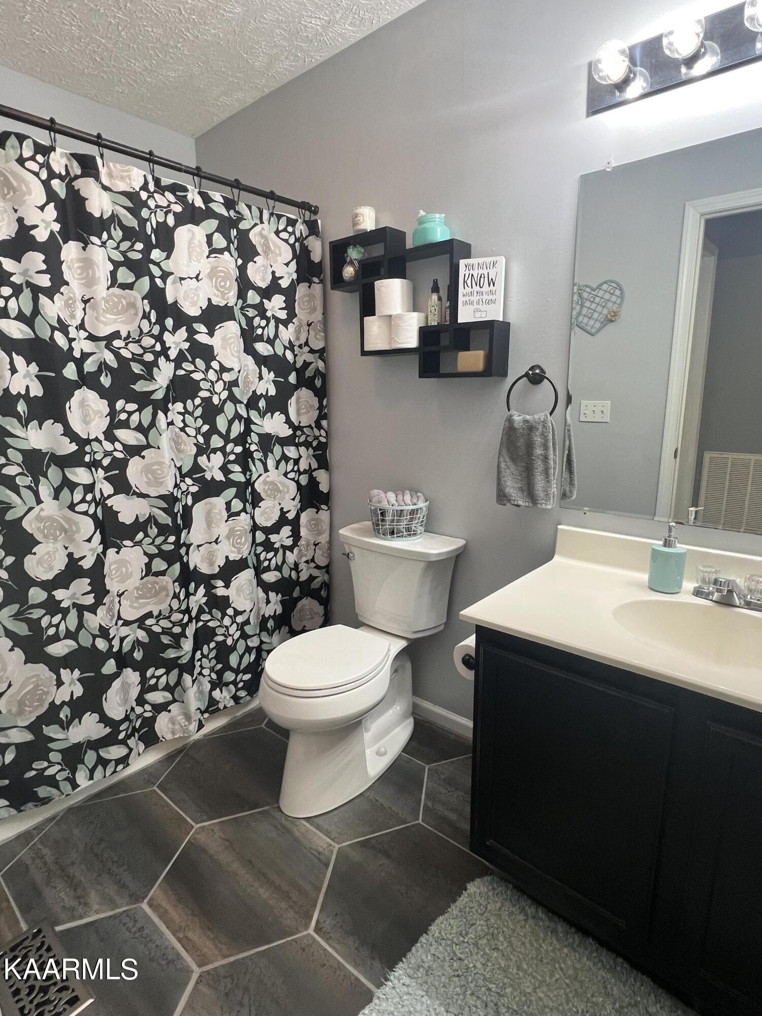 114 Bishop Street Alcoa, TN 37701 - Photo 13 of 20 a bathroom with a sink toilet and mirror