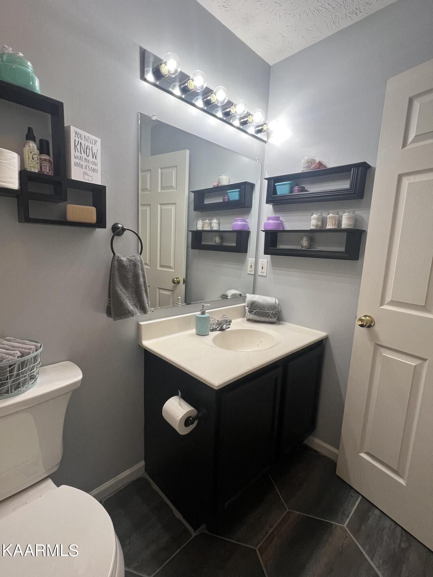 114 Bishop Street Alcoa, TN 37701 - Photo 15 of 20 a bathroom with a sink toilet and a mirror