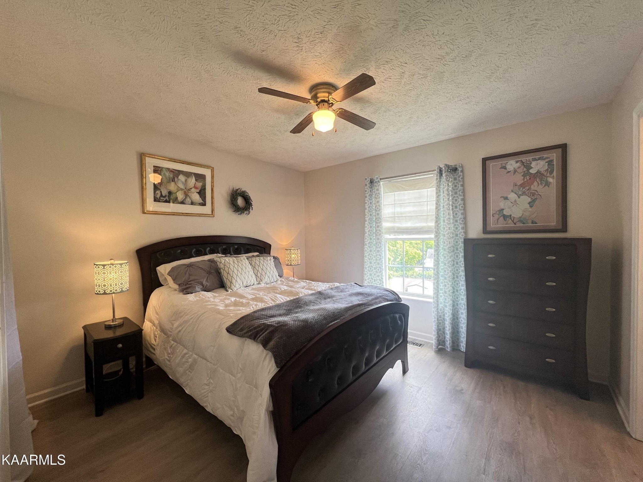 114 Bishop Street Alcoa, TN 37701 - Photo 16 of 20 a bedroom with a bed and a chandelier