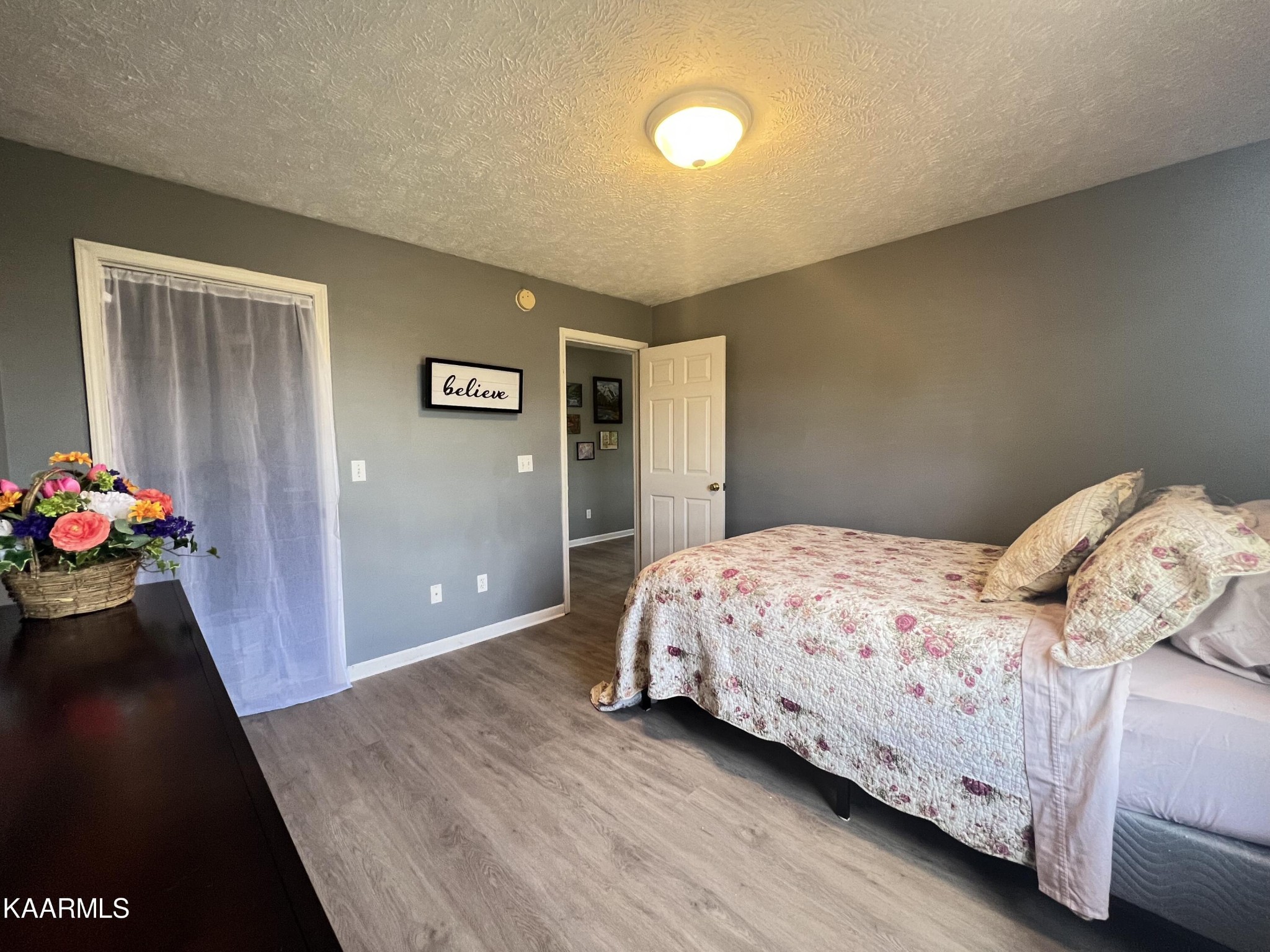 114 Bishop Street Alcoa, TN 37701 - Photo 17 of 20 a bedroom with a bed and a dresser