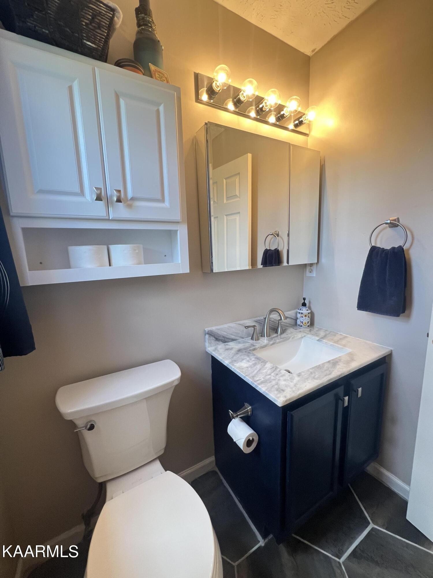 114 Bishop Street Alcoa, TN 37701 - Photo 20 of 20 a bathroom with a toilet sink and mirror