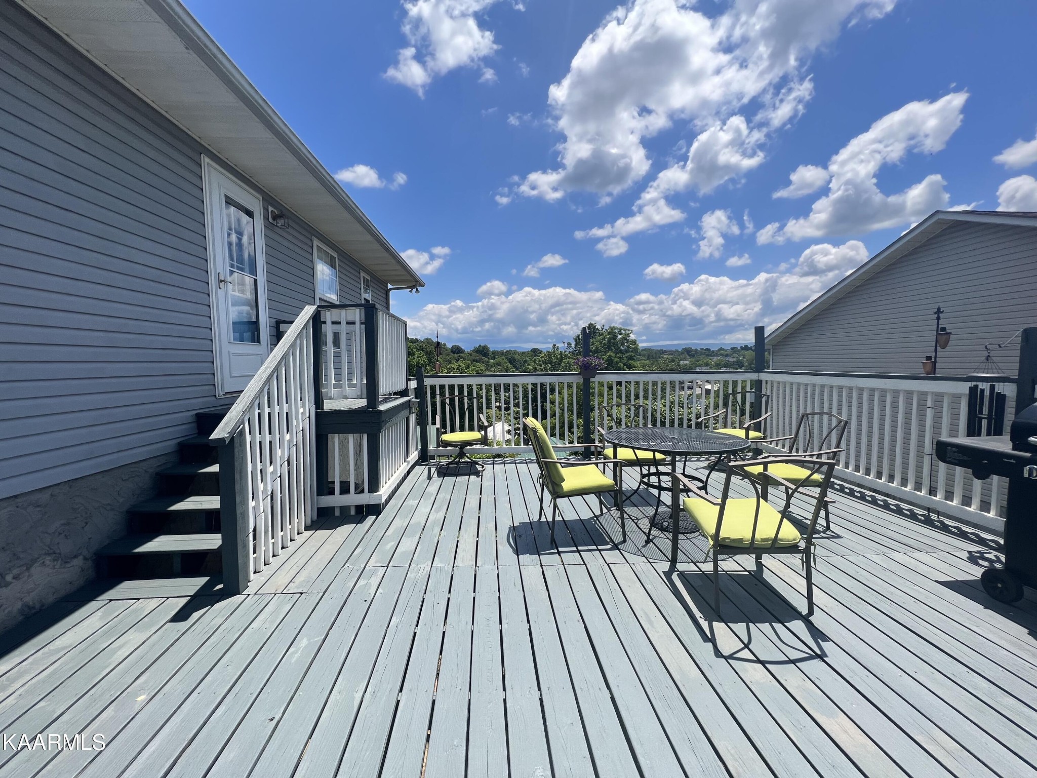114 Bishop Street Alcoa, TN 37701 - Photo 4 of 20 a view of sitting area with chairs on wooden deck