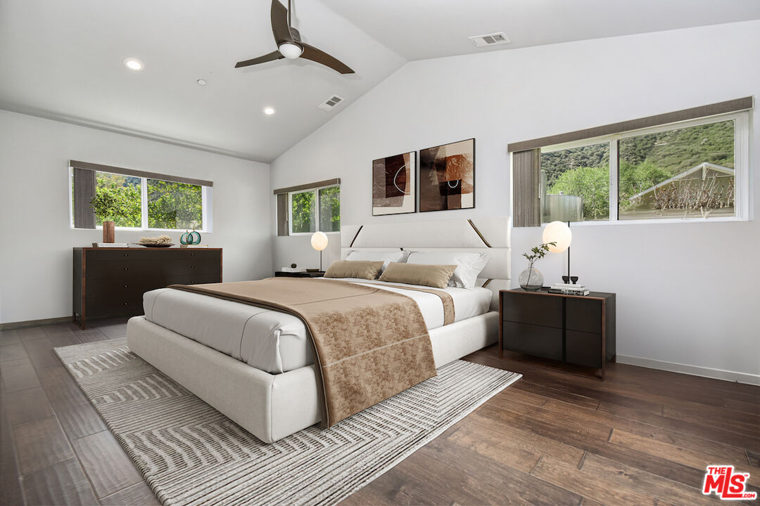 2447 Stonyvale Road Tujunga, CA 91042 - Photo 12 of 33 a room with a large bed and a window