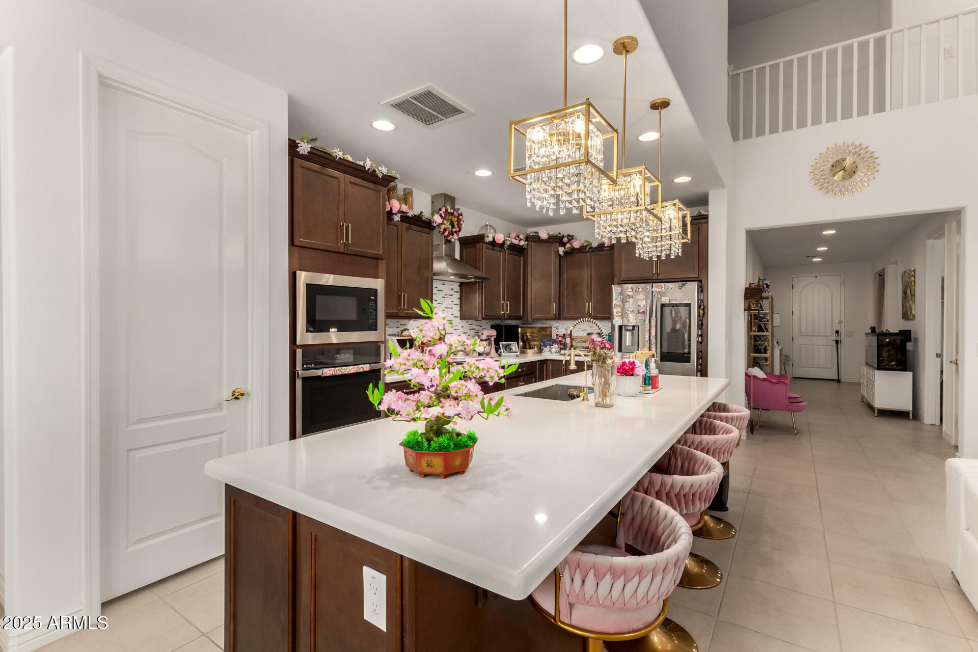 12120 West Pkwy Lane Avondale, AZ 85323 - Photo 15 of 45 a view of a dining room and kitchen with a table and chairs