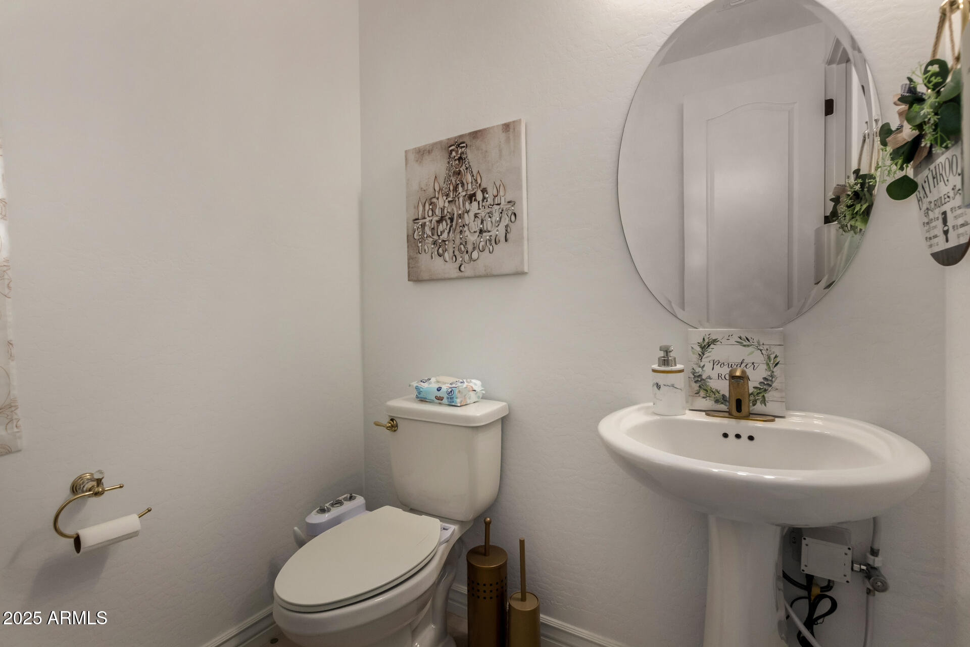 12120 West Pkwy Lane Avondale, AZ 85323 - Photo 18 of 45 a bathroom with a toilet a sink and mirror
