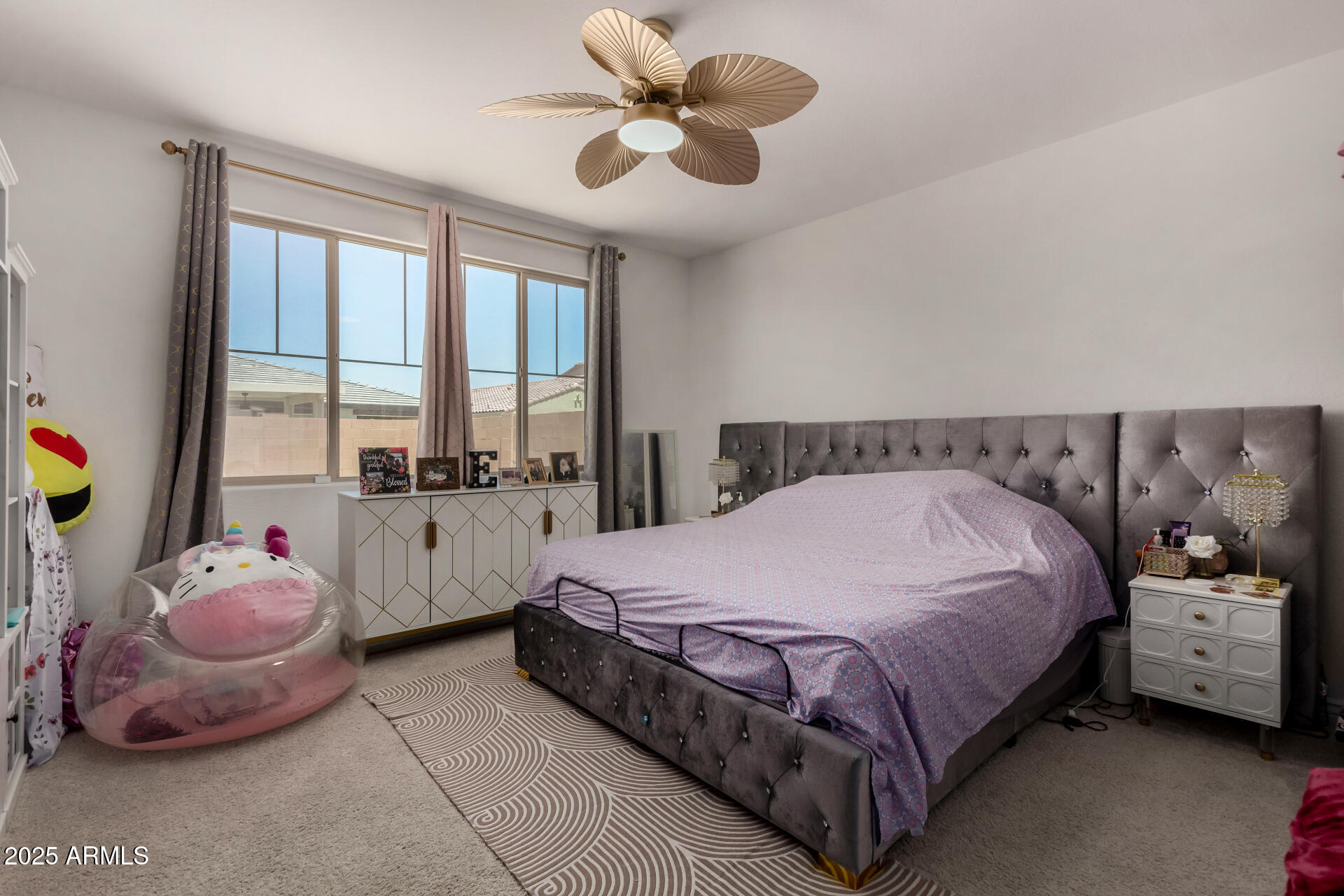 12120 West Pkwy Lane Avondale, AZ 85323 - Photo 19 of 45 a bedroom with a bed and large windows