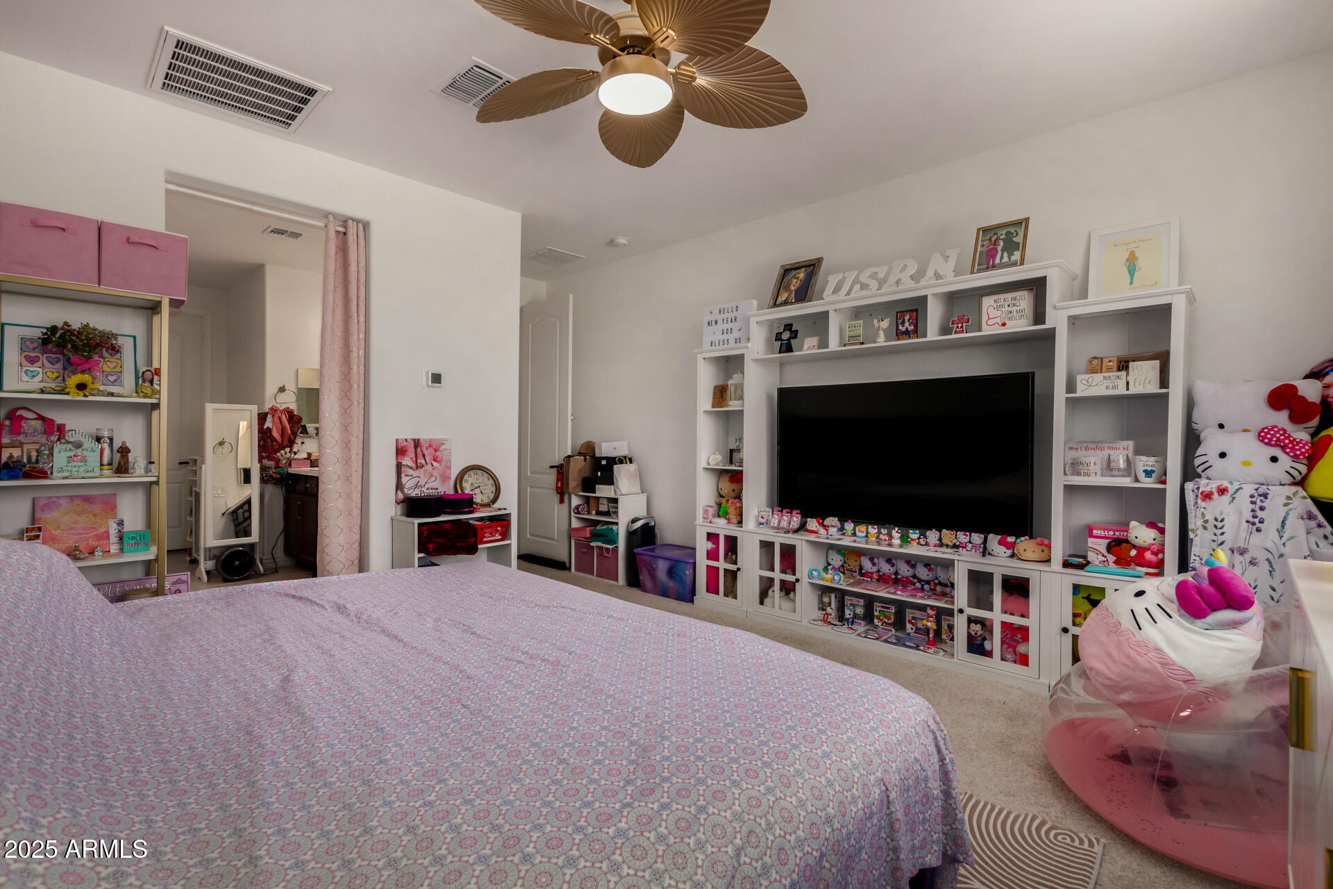 12120 West Pkwy Lane Avondale, AZ 85323 - Photo 20 of 45 a bedroom with bed and a flat tv screen on dresser