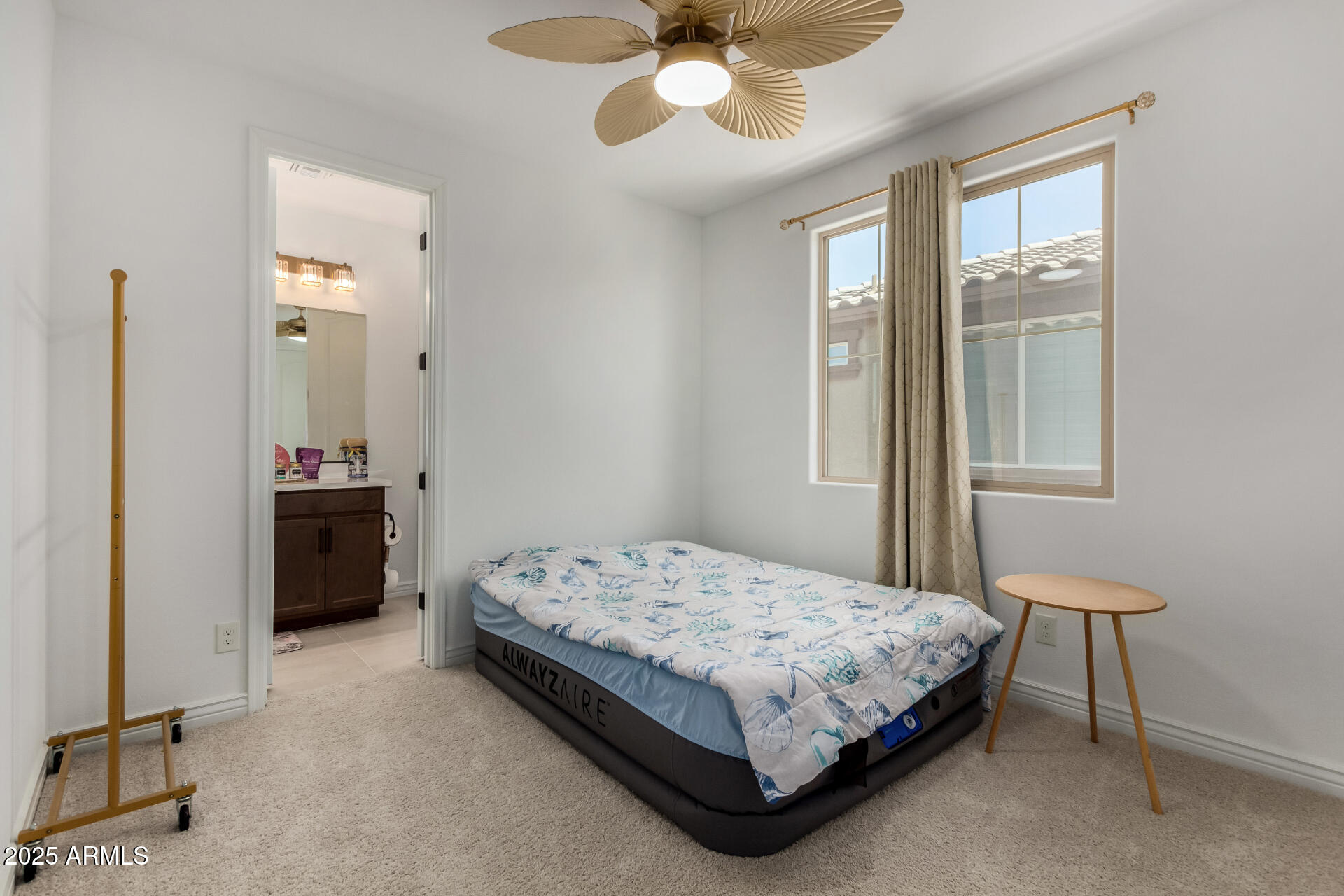 12120 West Pkwy Lane Avondale, AZ 85323 - Photo 31 of 45 a bedroom with a bed and a table in it