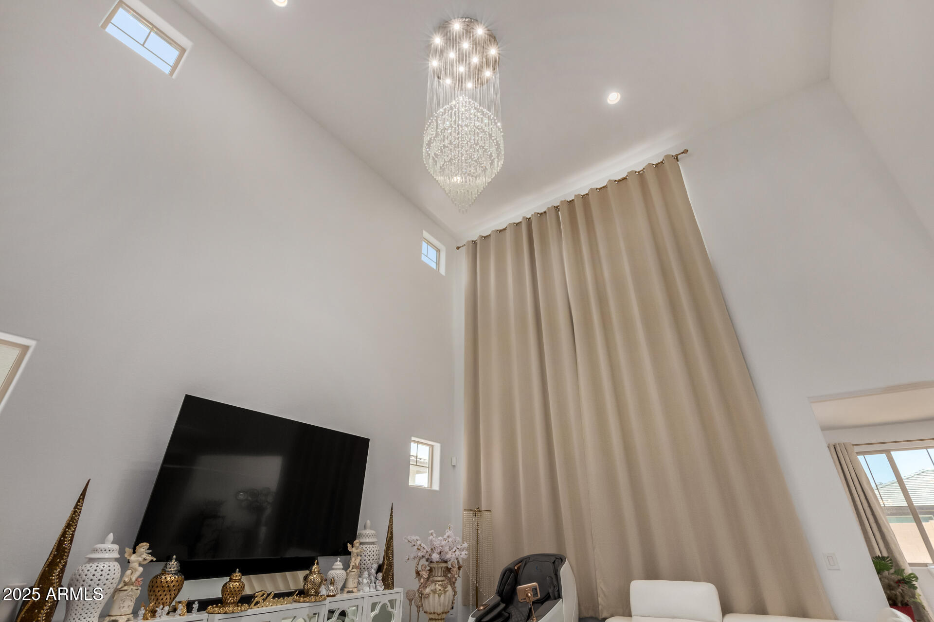 12120 West Pkwy Lane Avondale, AZ 85323 - Photo 35 of 45 a living room with furniture and a flat screen tv
