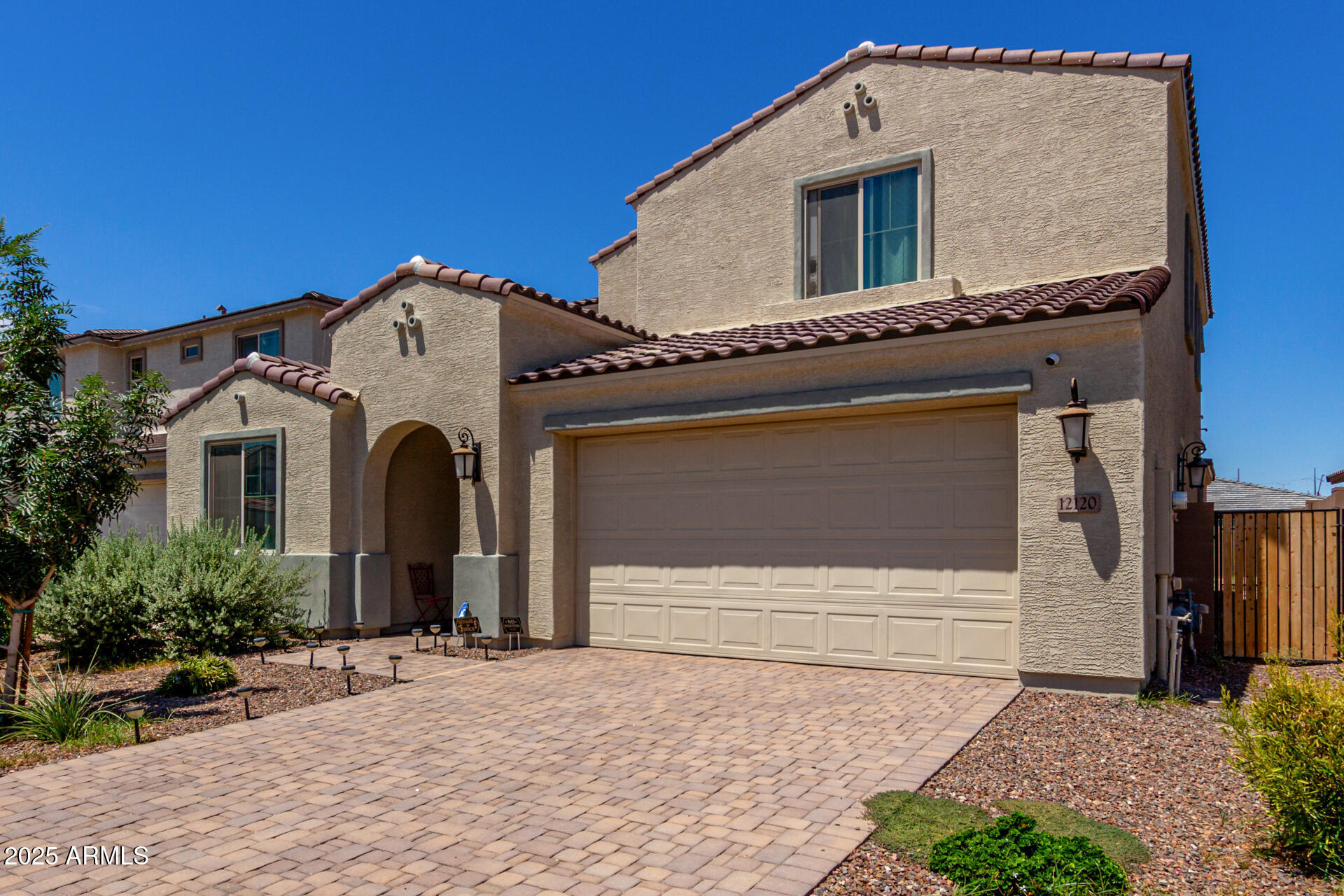 12120 West Pkwy Lane Avondale, AZ 85323 - Photo 6 of 45 a front view of a house with a yard
