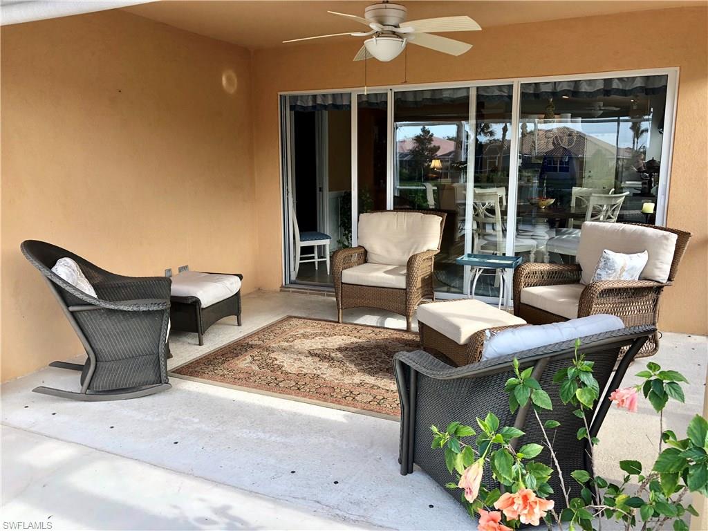 7640 Rozzini Lane Naples, FL 34114 - Photo 15 of 17 a backyard of a house with outdoor seating