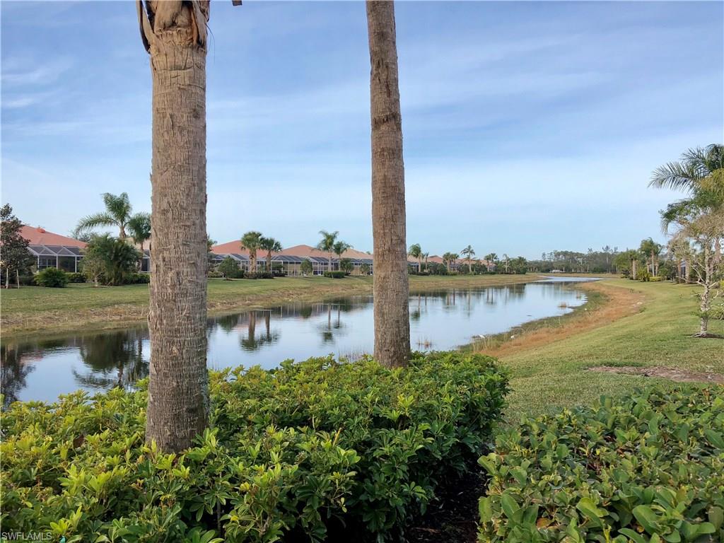 7640 Rozzini Lane Naples, FL 34114 - Photo 17 of 17 a lake view with boat and palm trees