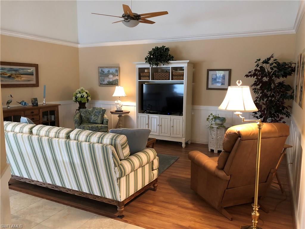 7640 Rozzini Lane Naples, FL 34114 - Photo 3 of 17 a living room with furniture and a flat screen tv