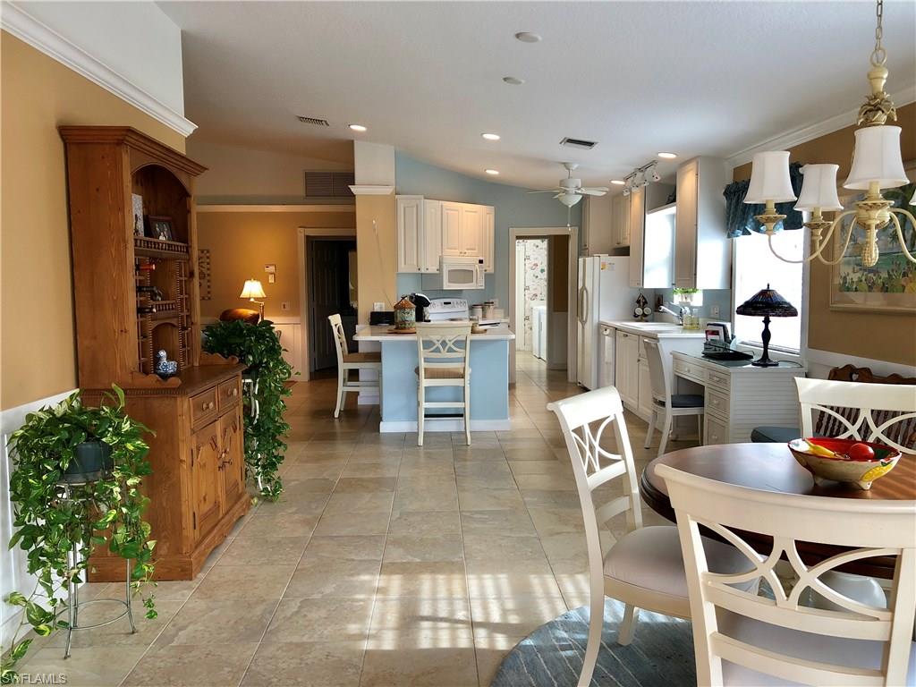 7640 Rozzini Lane Naples, FL 34114 - Photo 5 of 17 a view of a dining room with furniture