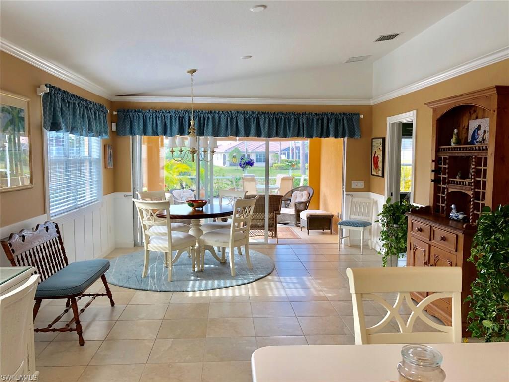 7640 Rozzini Lane Naples, FL 34114 - Photo 8 of 17 a view of a livingroom with furniture and a large window