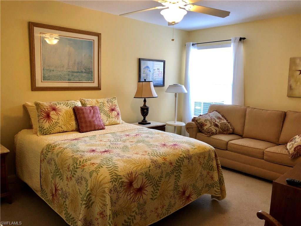 7640 Rozzini Lane Naples, FL 34114 - Photo 10 of 17 a bedroom with bed and window