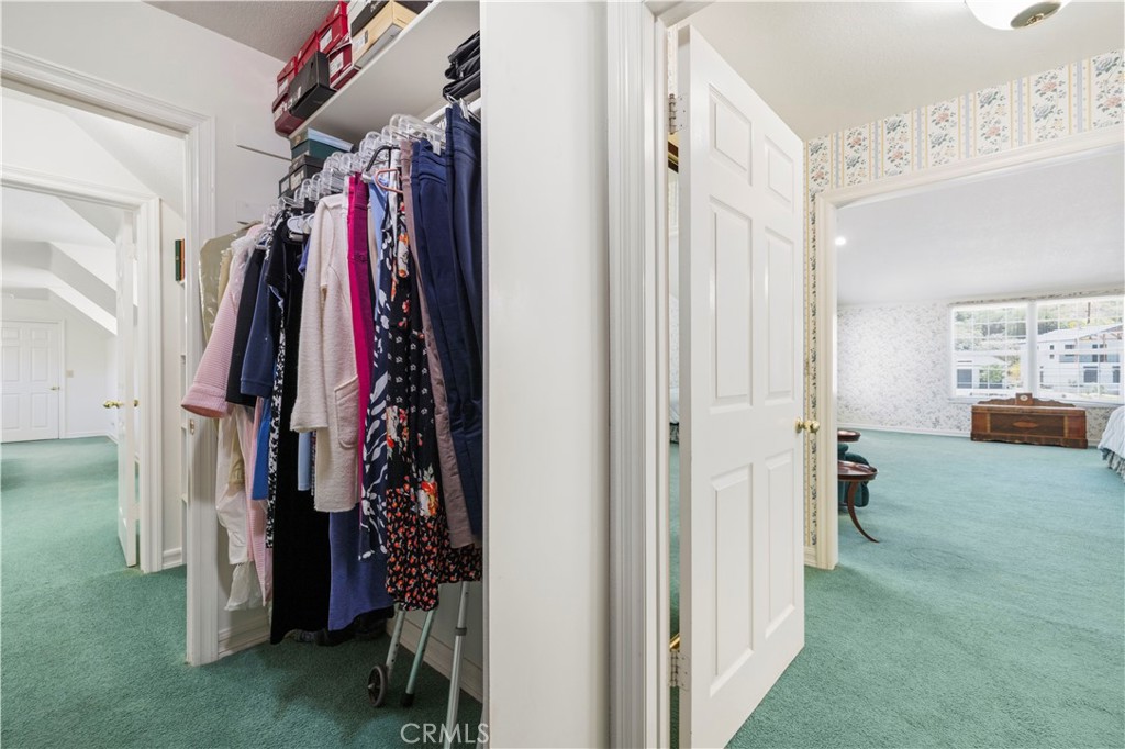 25707 Pacy Street Newhall, CA 91321 - Photo 42 of 62 primary bedroom walk-in closet