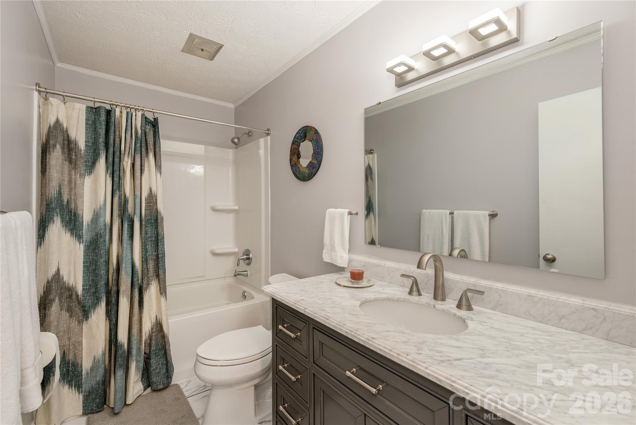 231 Allen Road East Flat Rock, NC 28726 - Photo 25 of 42 a bathroom with a granite countertop sink toilet and shower