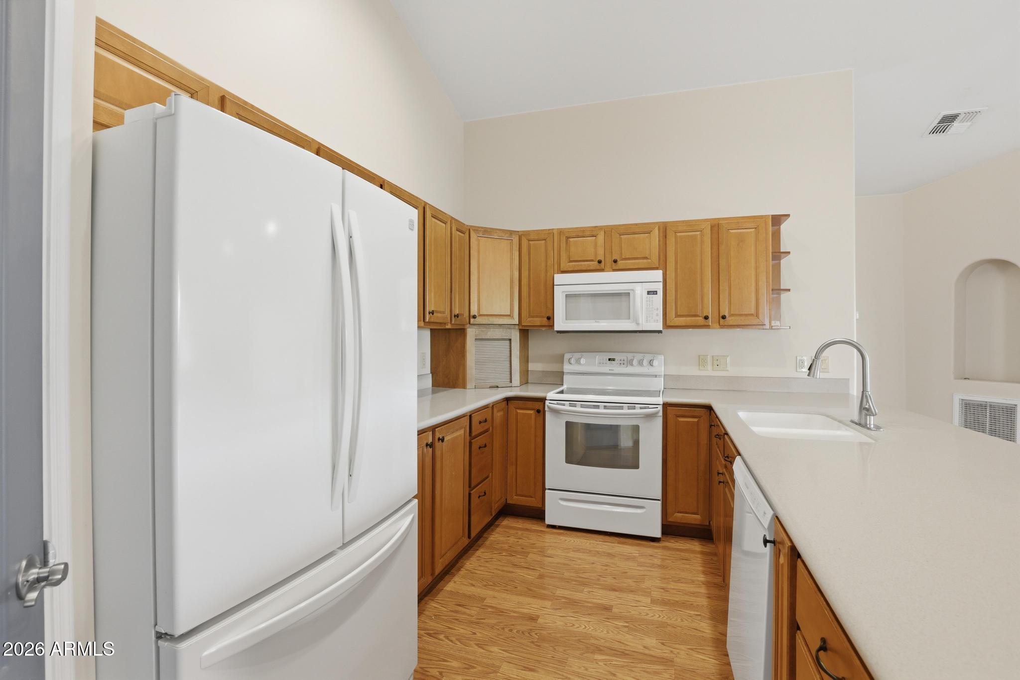 408 East Phoenix Street Payson, AZ 85541 - Photo 11 of 35 a kitchen with stainless steel appliances granite countertop a sink stove and refrigerator