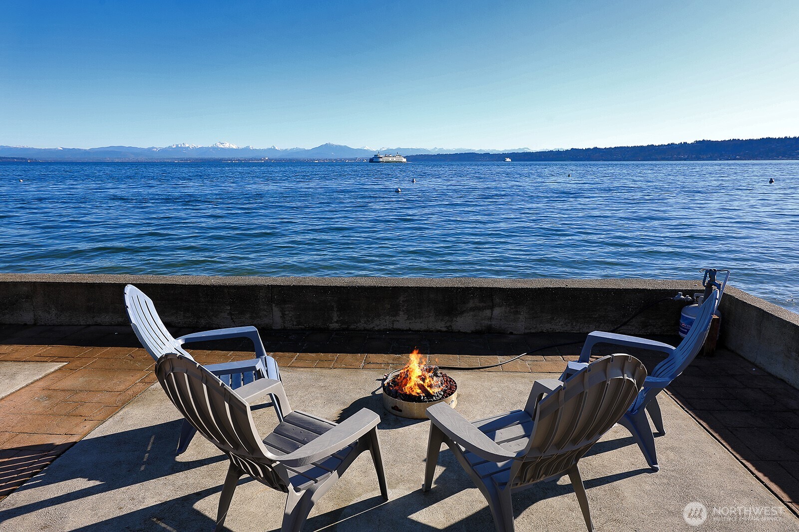 4913 Marshall Road Clinton, WA 98236 - Photo 17 of 40 a view of a chairs and table on the deck