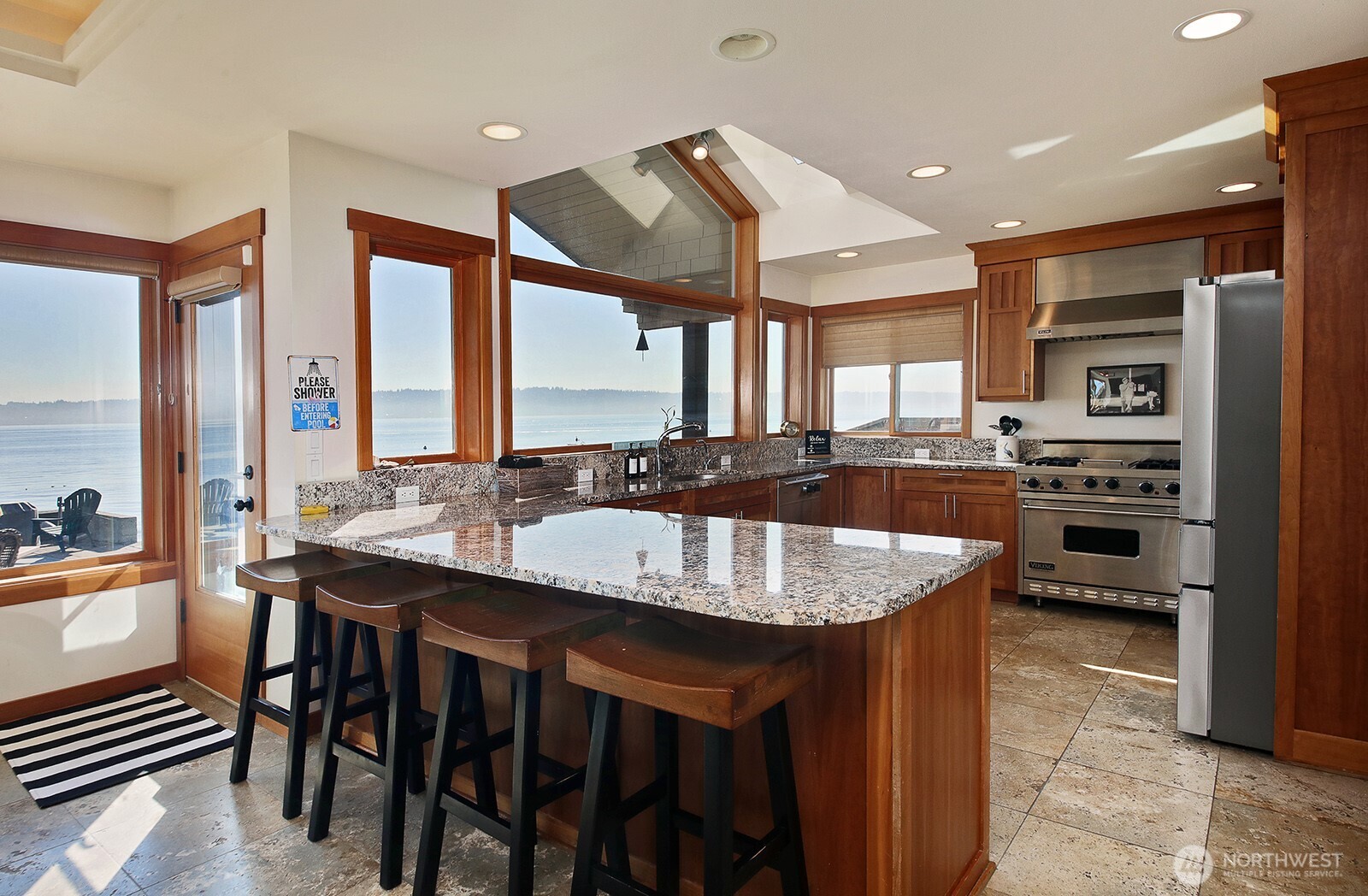 4913 Marshall Road Clinton, WA 98236 - Photo 18 of 40 a large kitchen with a table and chairs